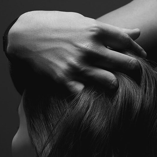 Hand in hair